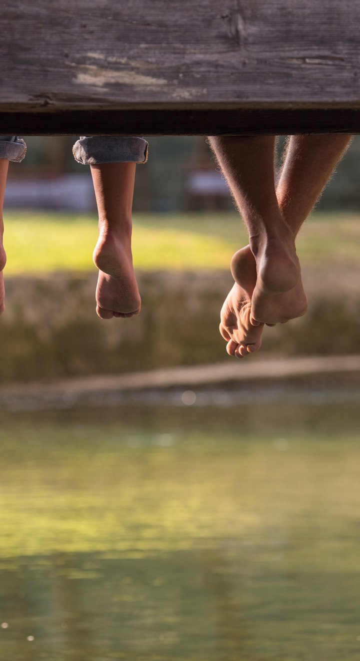 people over a river